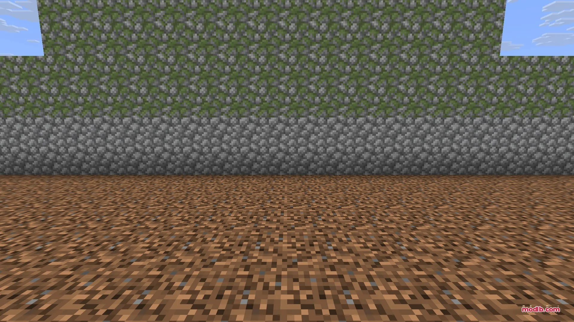 Ancient Artifacts 2 Data Pack Screenshot 1 A wall made of cobblestone and mossy cobblestone blocks on dirt ground