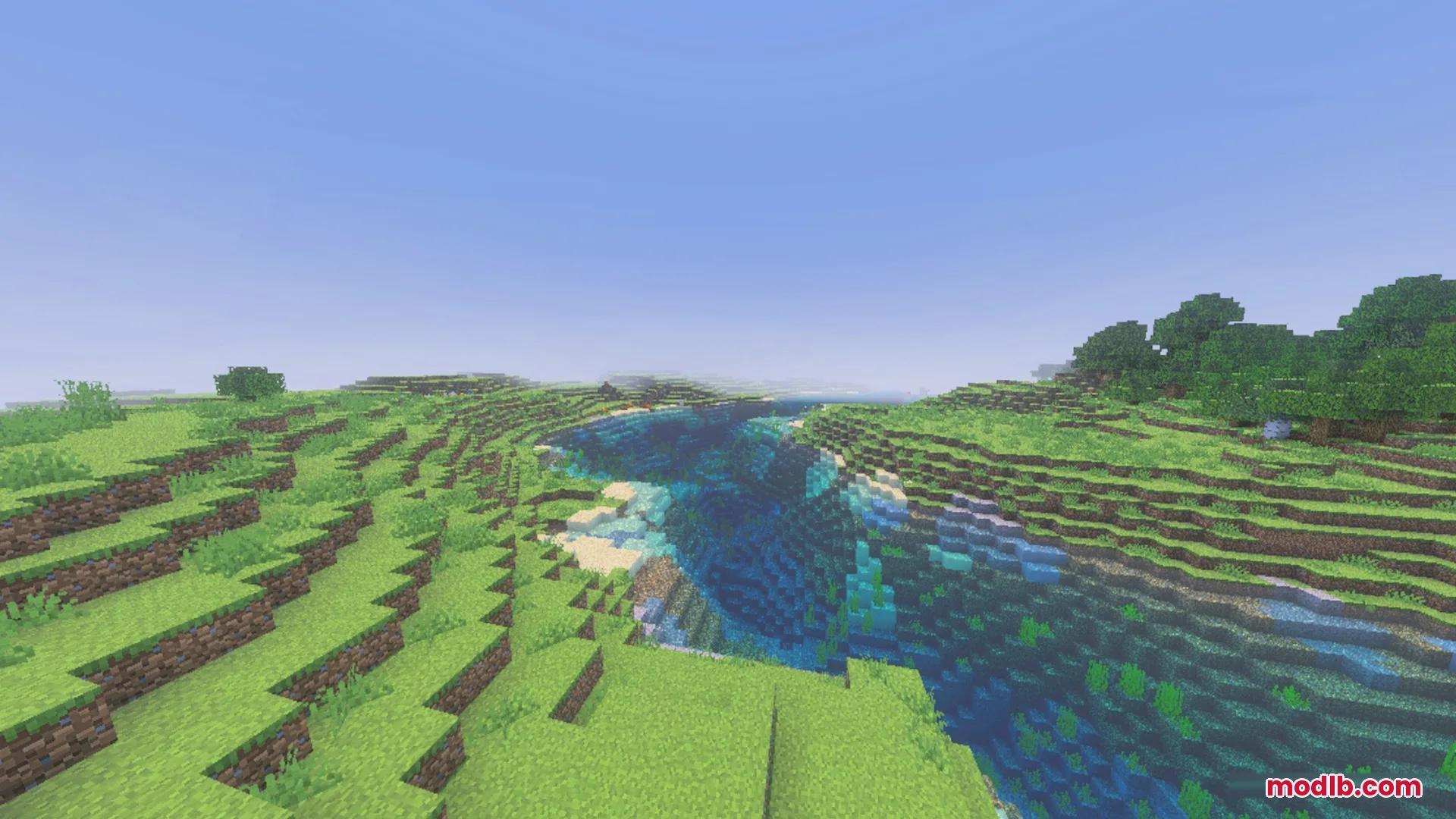 Vibrant green hills and clear water flowing through a peaceful Minecraft landscape