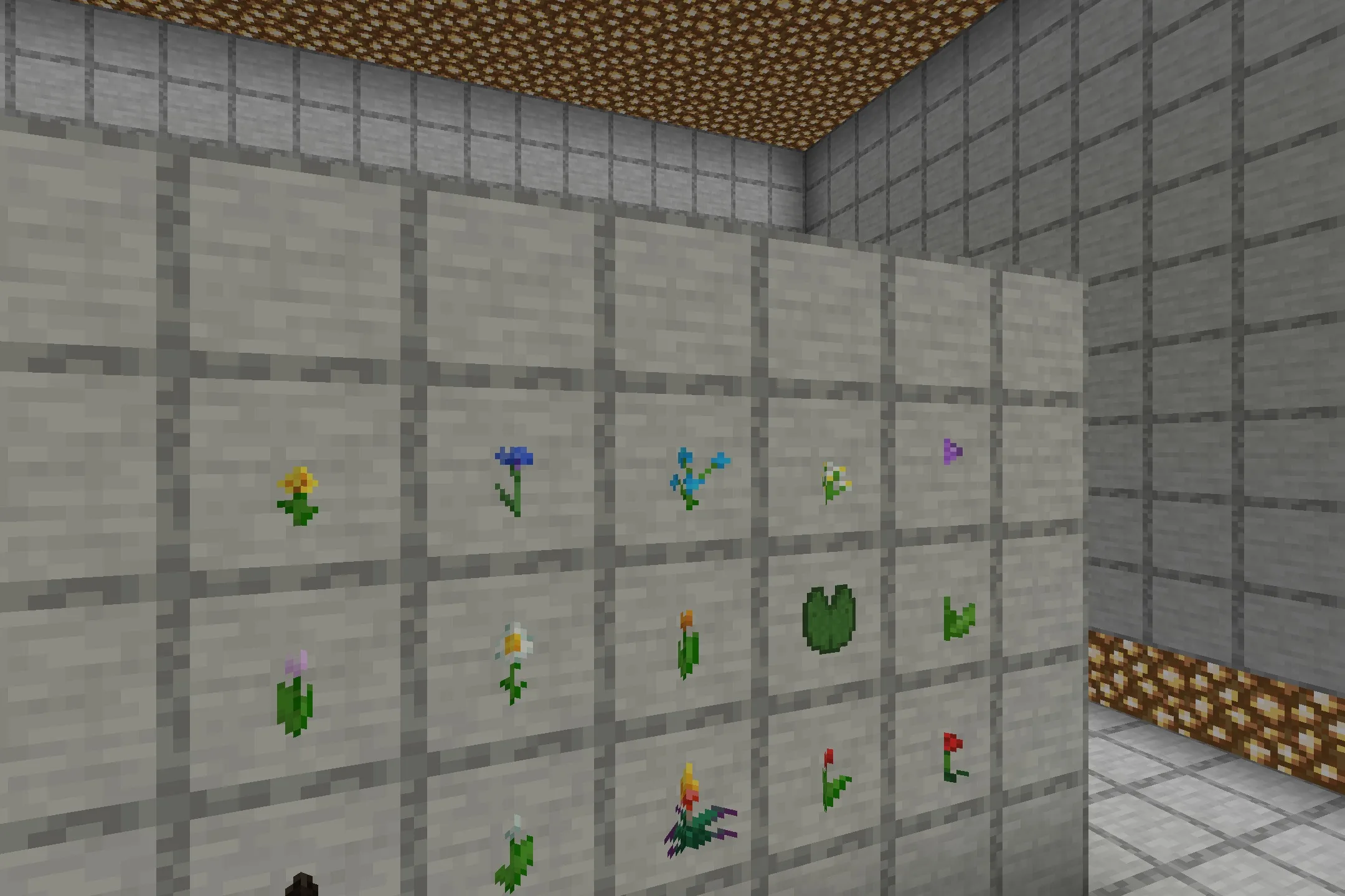 Close up of 3D flowers and lily pads shown in item frames on wall