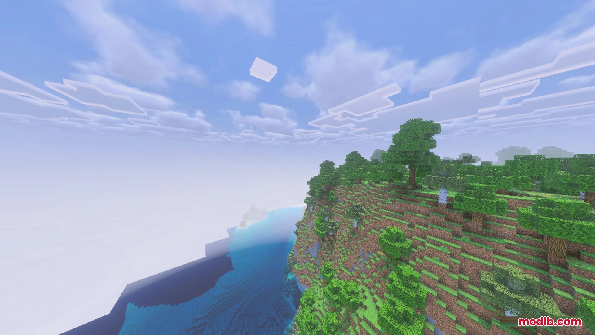 Complementary Unbound Clouds Shader Screenshot 5 Complementary Unbound Clouds shader showing soft white clouds over a steep cliffside