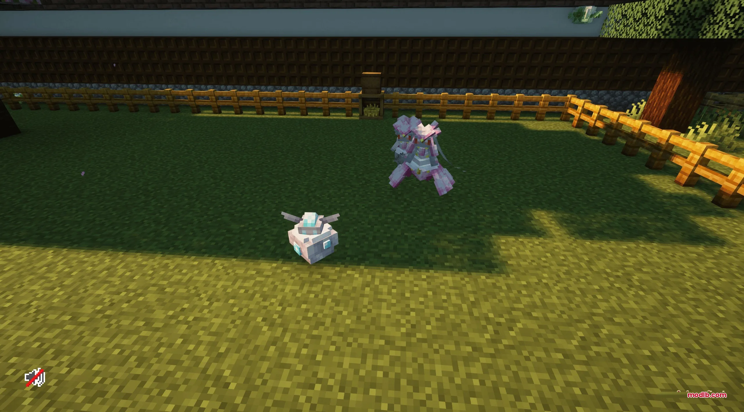 Two custom modeled Cobblemon standing on grass inside a wooden fence