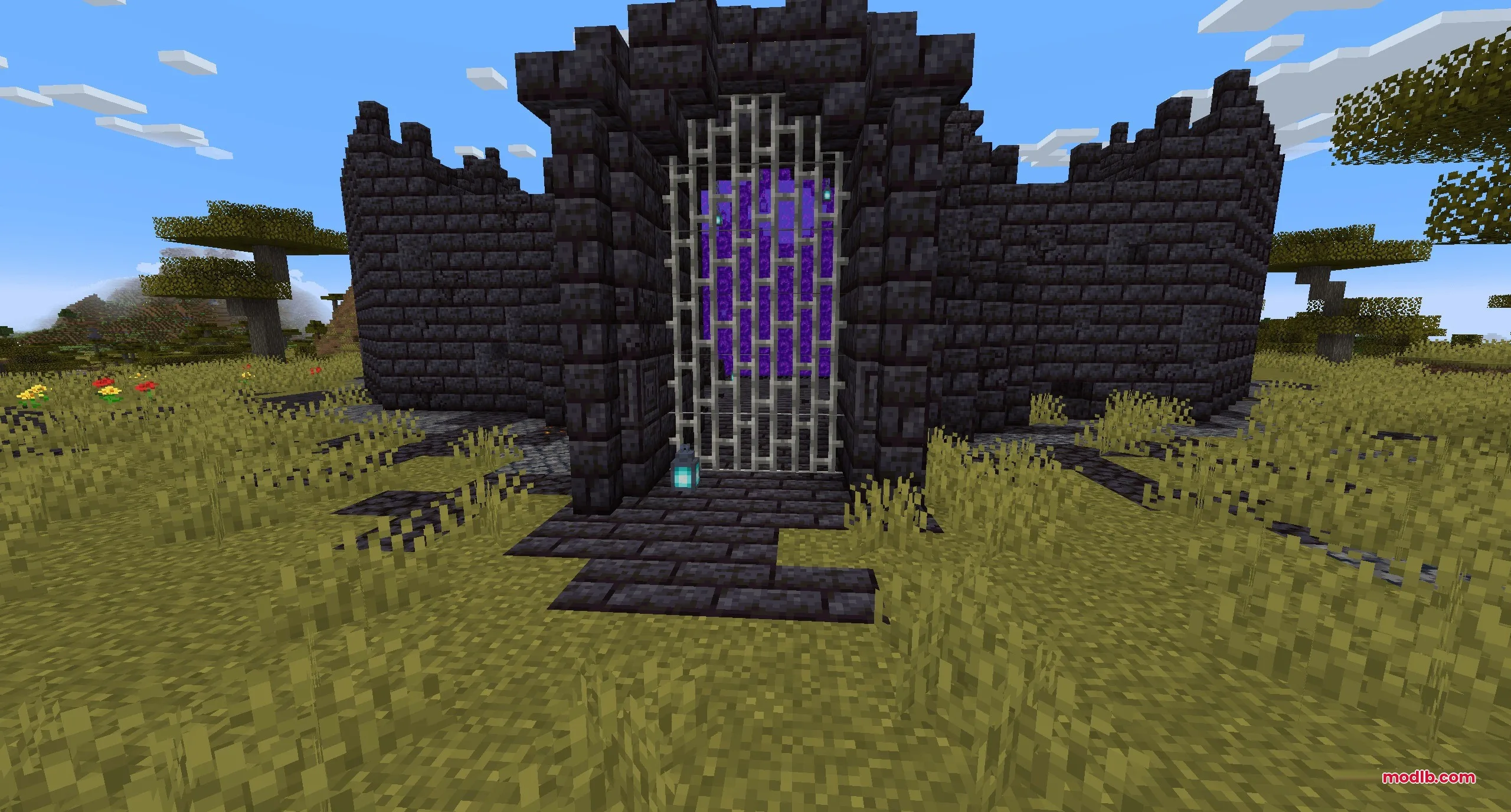 Dimensional Breach Scars Data Pack Screenshot 2 A blackstone fortress gate in the savanna biome containing a Nether portal