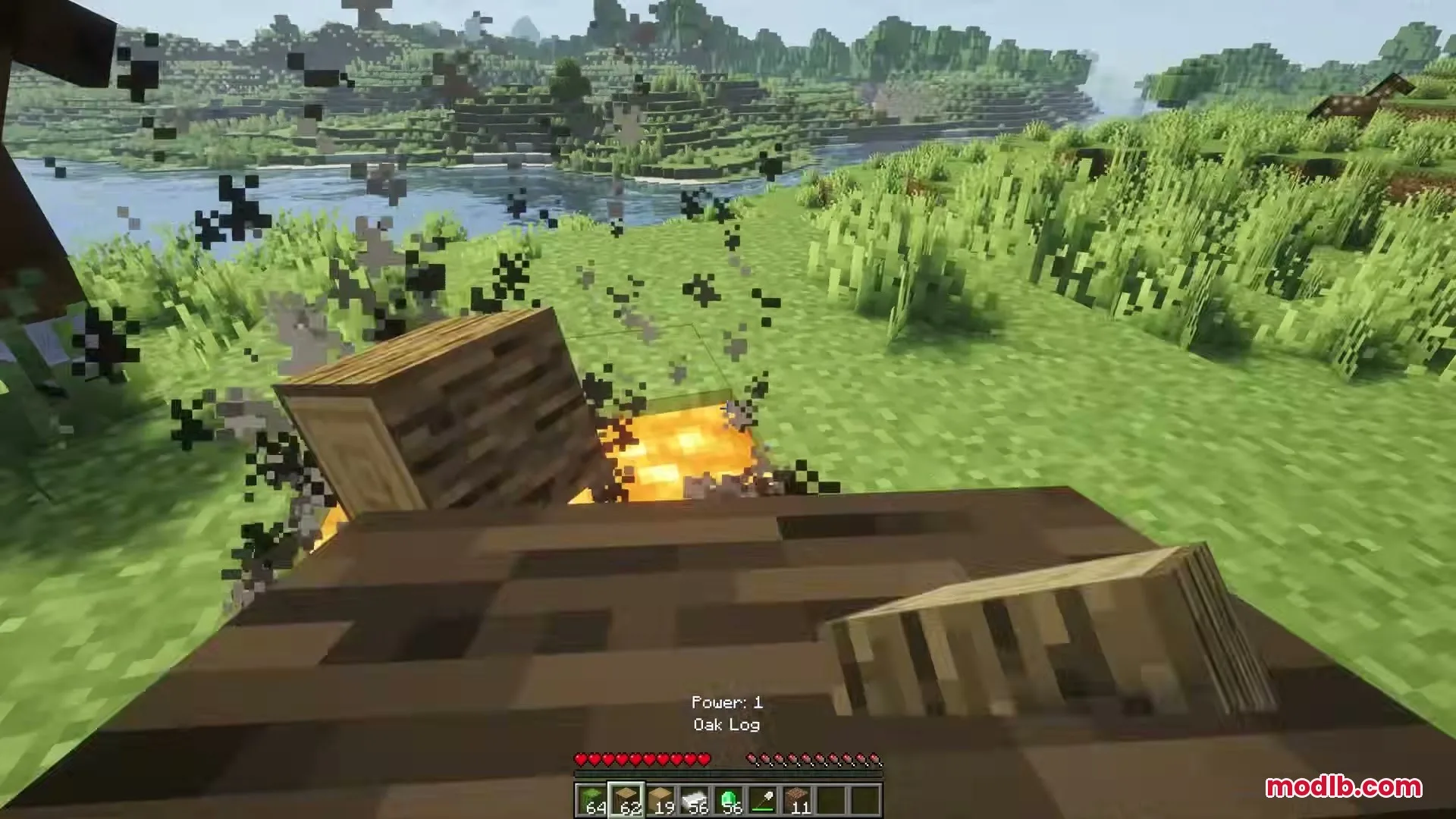 Eating Animations Mod Screenshot 8 Player holds an oak log with a bite animation near a lava pit