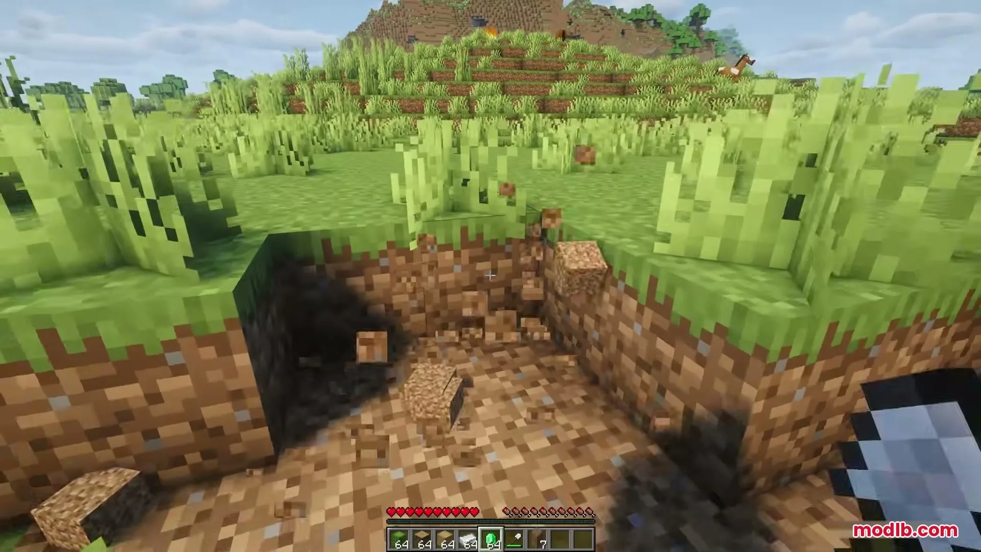 Eating Animations Mod Screenshot 1 Player digging a hole in the ground with dirt blocks breaking apart