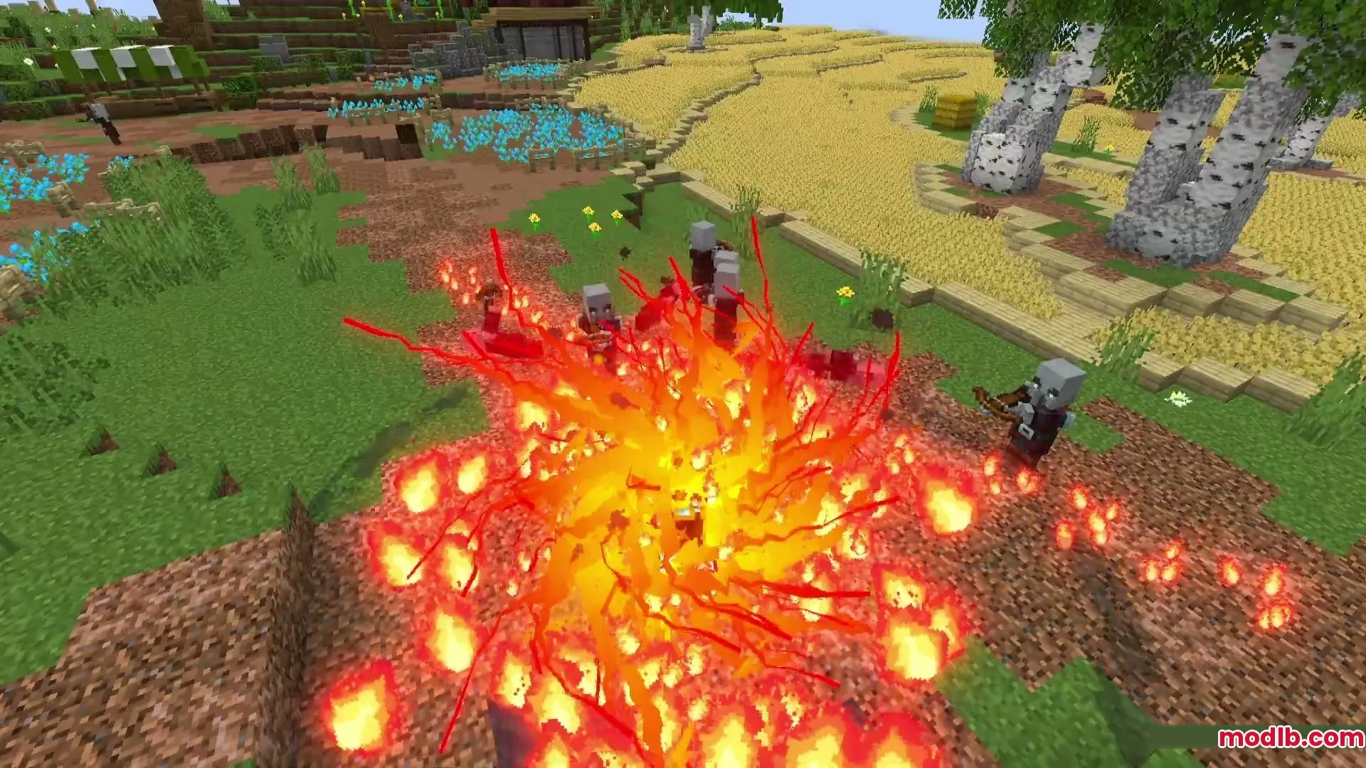 A massive fire explosion engulfs a group of hostile Illagers in a field