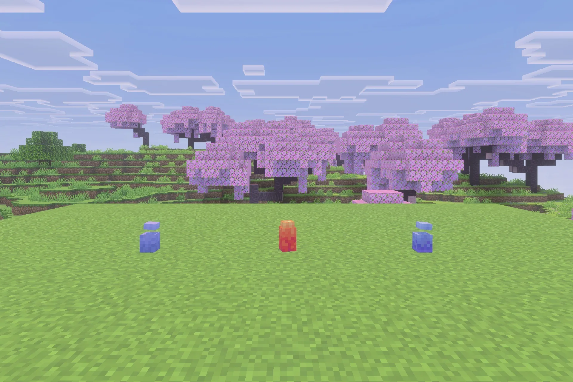 Three colorful dragon eggs from the Fire and Steel Dragons mod on grass