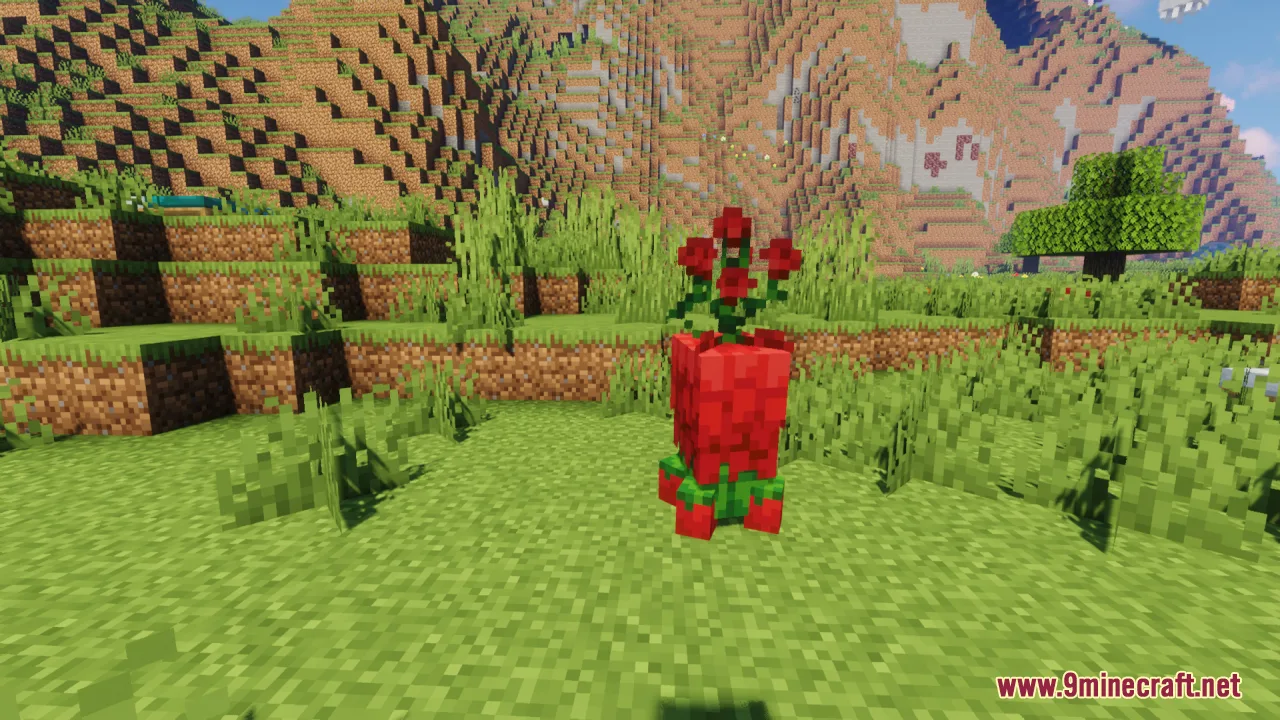 A short red creeper made of flower petals standing in a grassy area