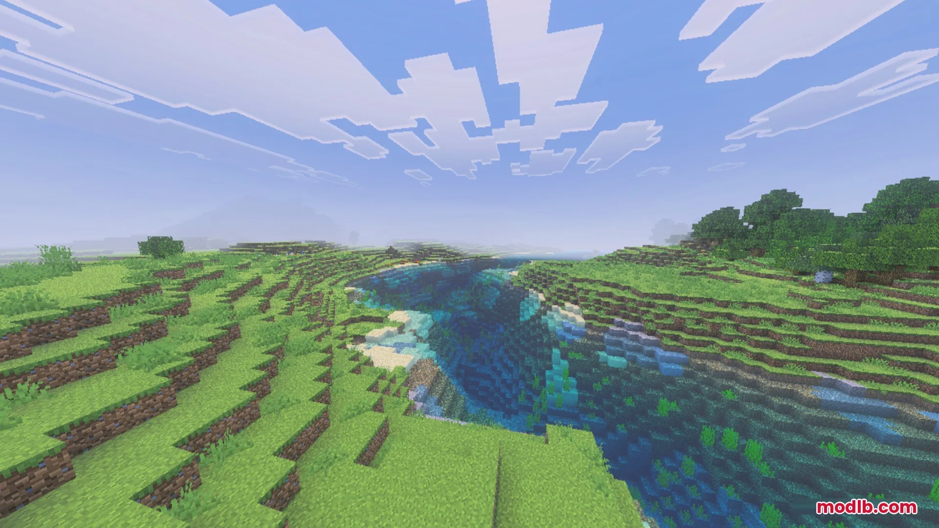 Scenic view of a deep river valley surrounded by lush green hills