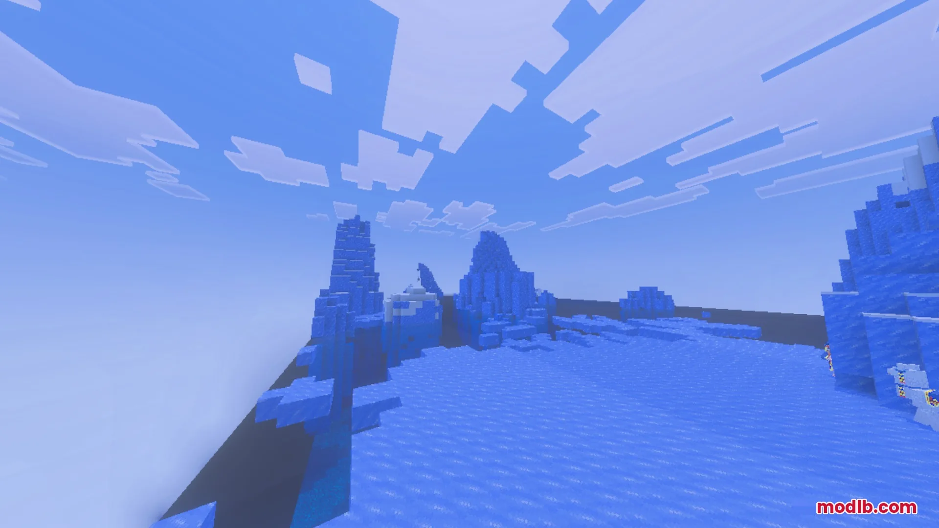 A vast frozen landscape featuring tall ice spikes under a bright blue sky