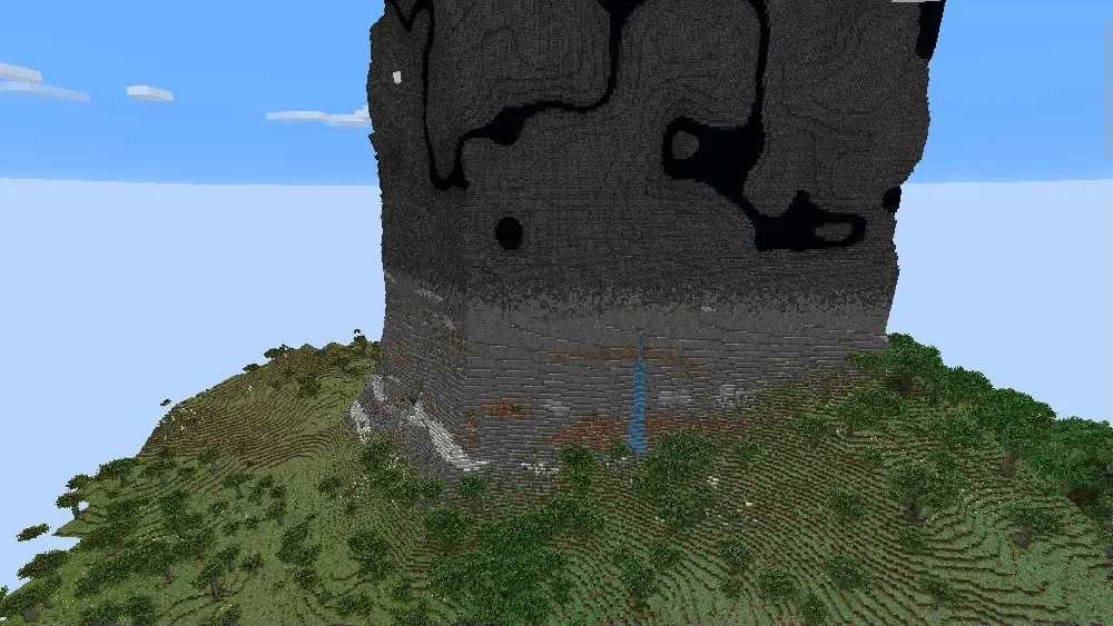 A massive dark stone Obelisk structure towering over the natural green terrain