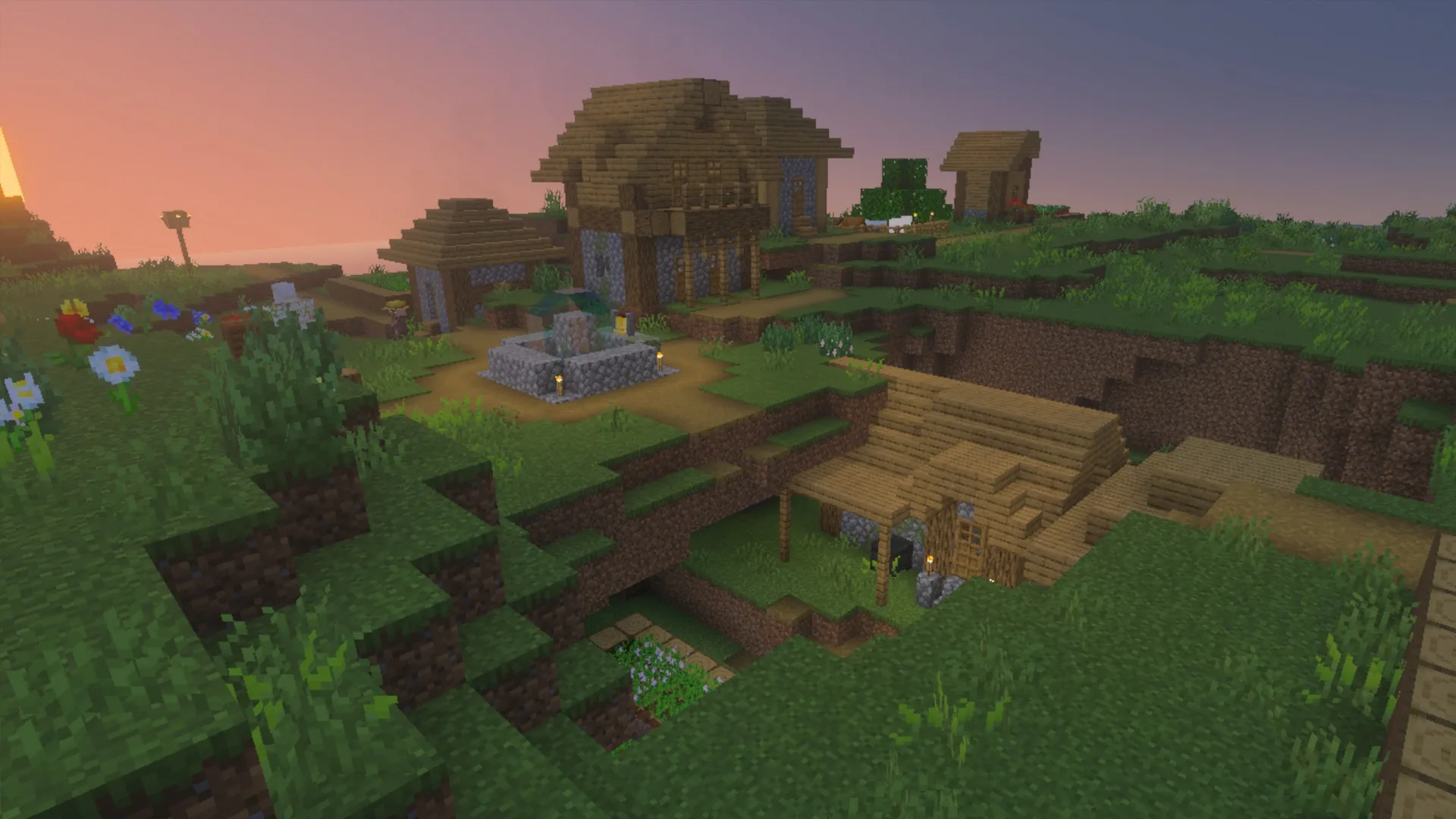 Wooden houses and a village fountain at sunset with the La Nature pack