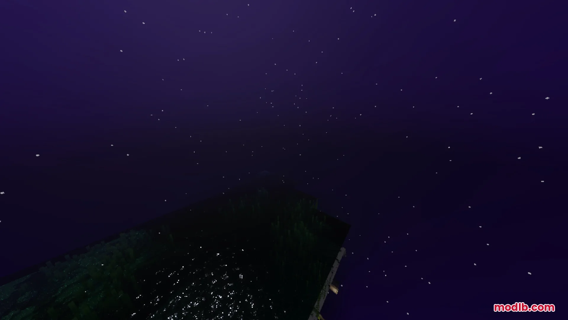 Deep purple night sky with numerous stars shining over a dark landscape