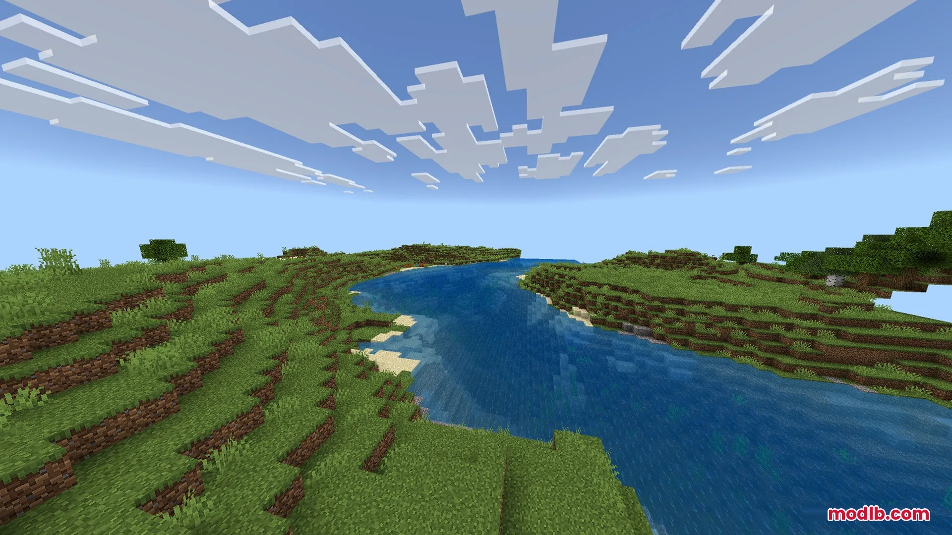 Clear river water with sky reflections flowing through a green plains biome