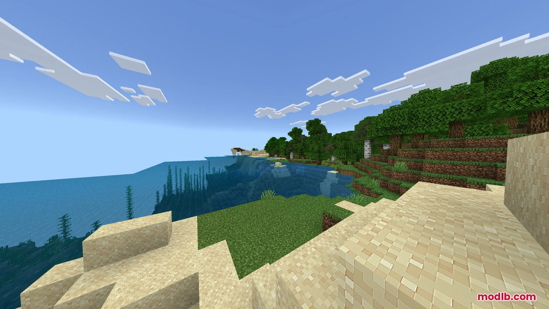 A bright coastal view featuring sandy shores and clear blue ocean water