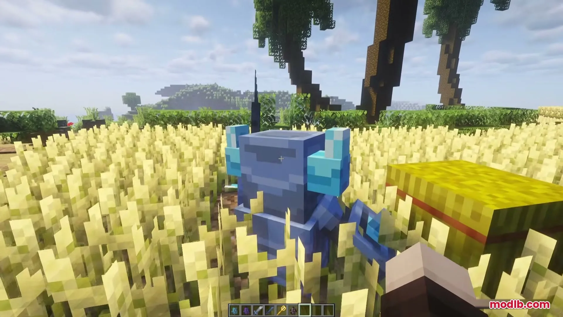 Blue Mini PEKKA stands in a golden wheat field