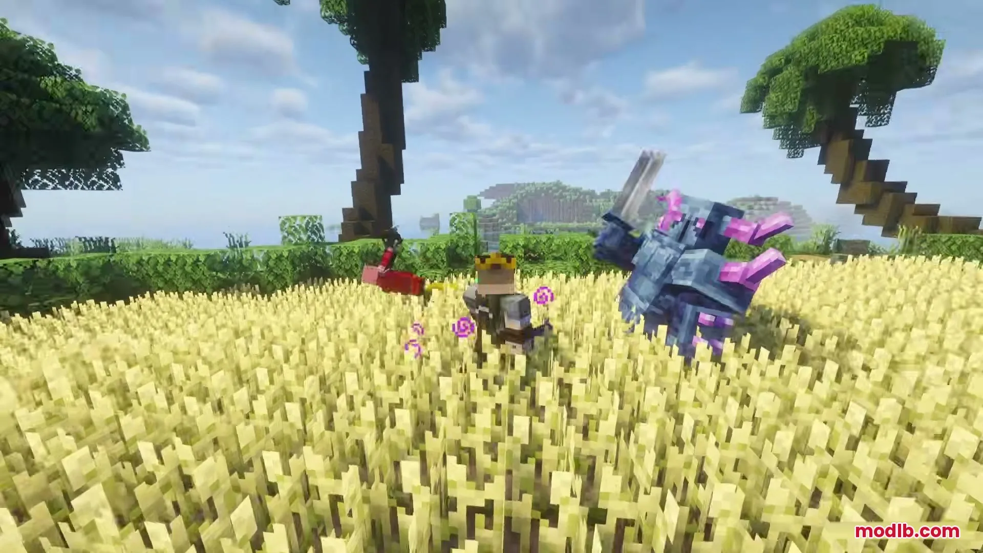 Blue armored mob fighting in a wheat field near a crowned player