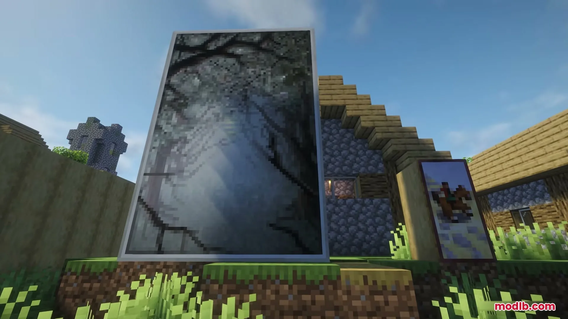 A large vertical landscape painting and a smaller horse painting in Minecraft