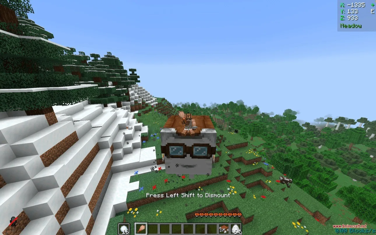 Player riding a small Happy Ghast over a snowy mountain in Minecraft
