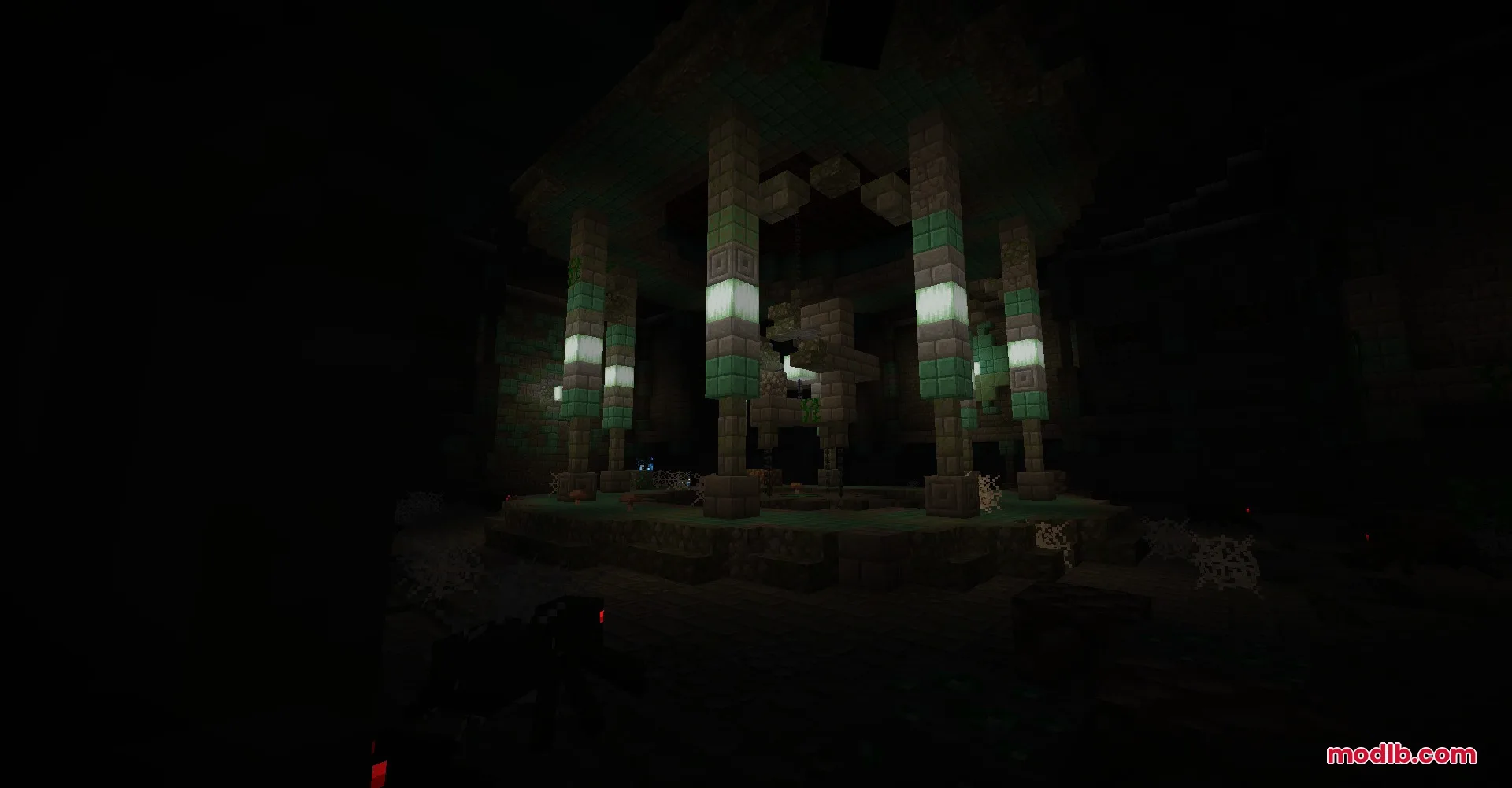 Dark interior of a monument with glowing froglights and stone pillars with cobwebs