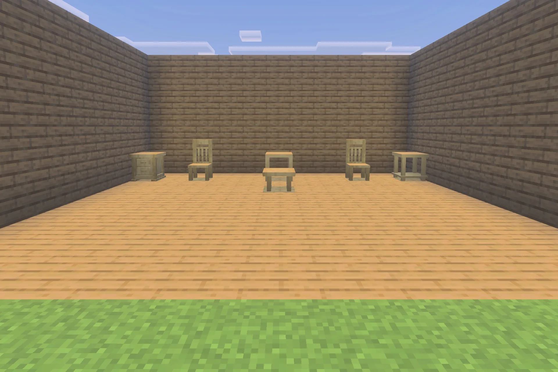 A collection of wooden chairs and tables displayed in a simple room
