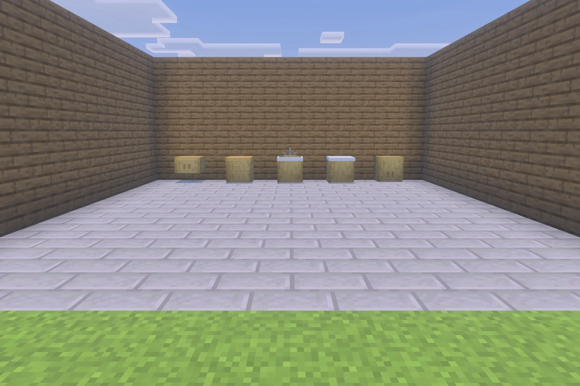 Functional kitchen and bathroom fixtures arranged on a stone brick floor