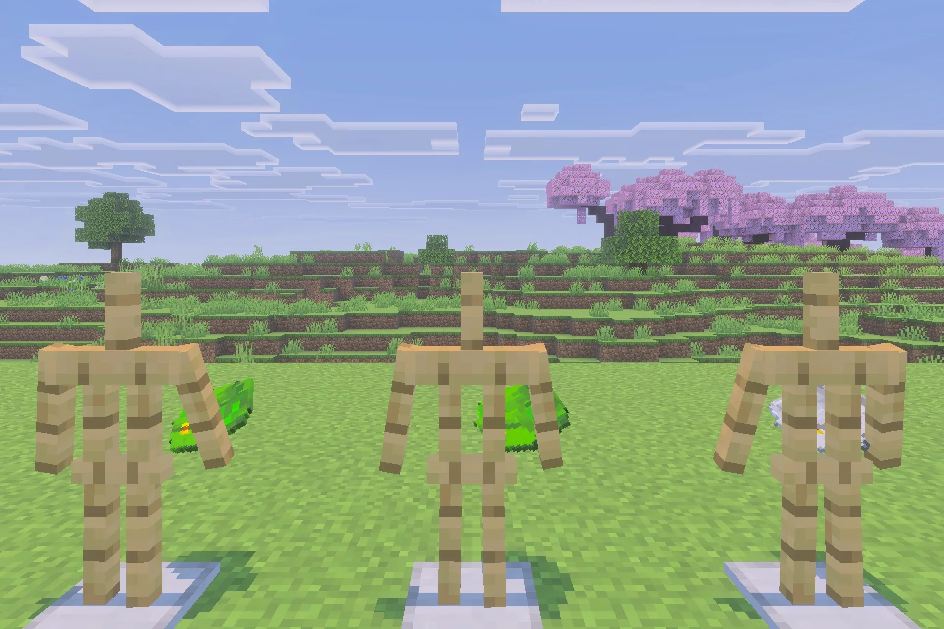Simple Backpack Achievement Friendly No Lag Addon Screenshot 2 Three armor stands showcasing various backpack designs in a wide grassy field