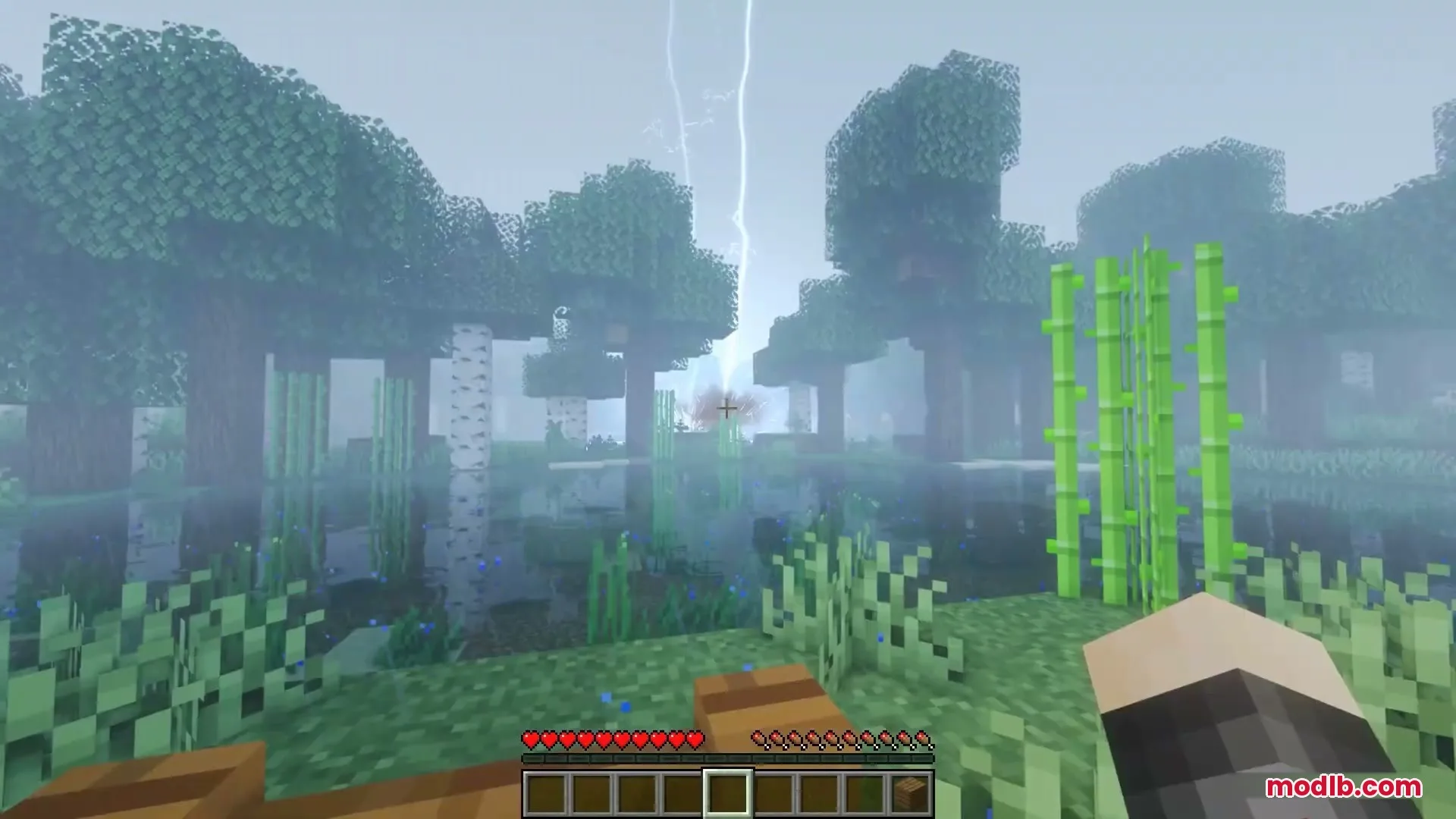 Skybolt Resonance Mod Screenshot 8 A bright lightning bolt strikes the ground in a foggy Minecraft forest