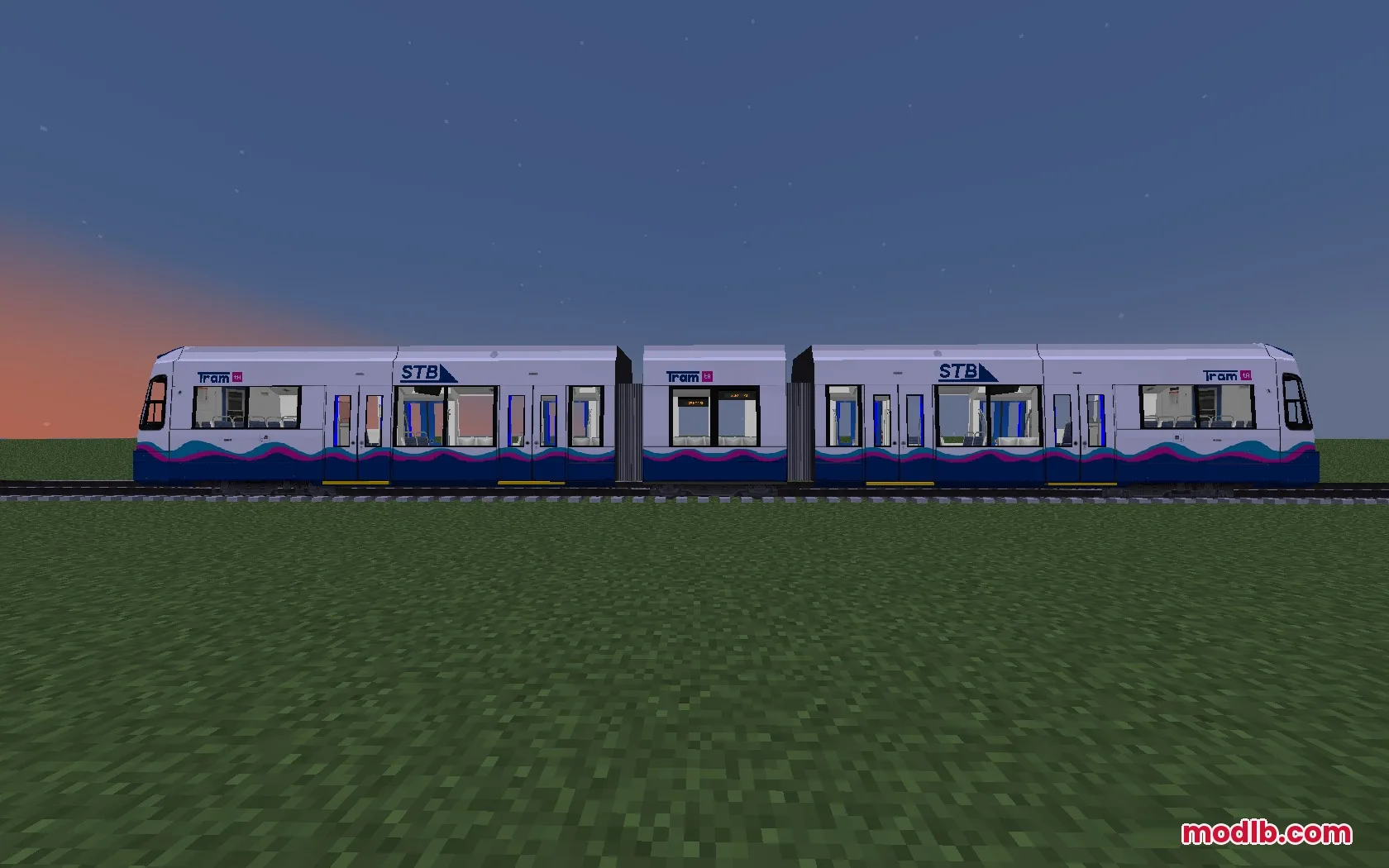 A side view of a white and blue light rail tram on tracks