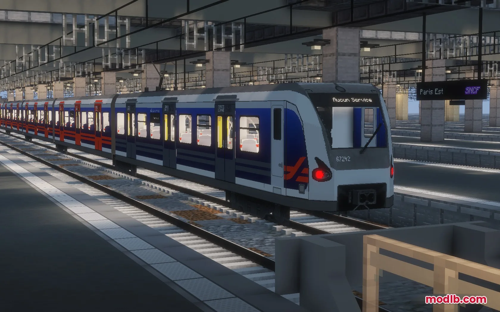 A blue and white SNCF train stopped at a detailed Minecraft station platform