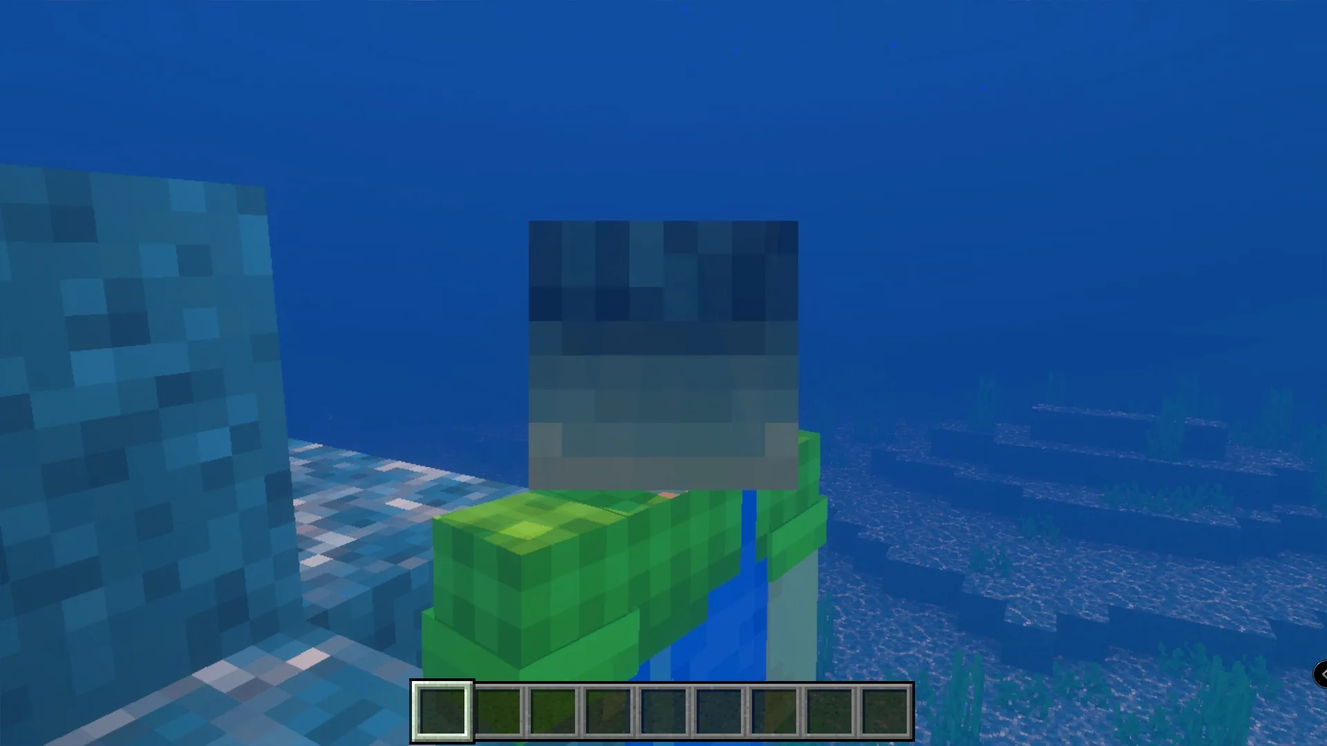Twixxel's Stalkers Addon Screenshot 7 Minecraft player wearing a grey monster head while swimming in the deep ocean