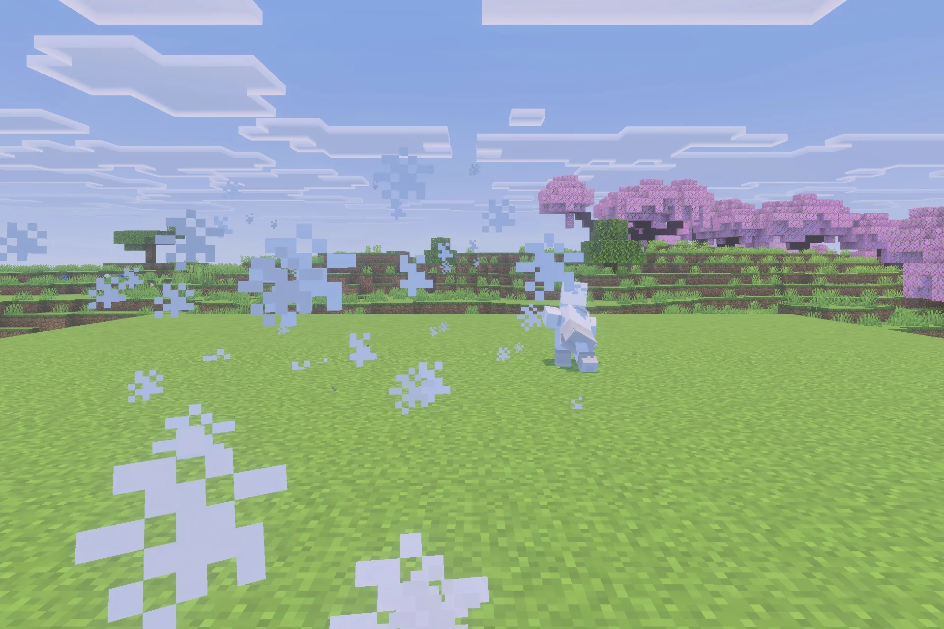 A player performs an explosive landing with white particles on the grass