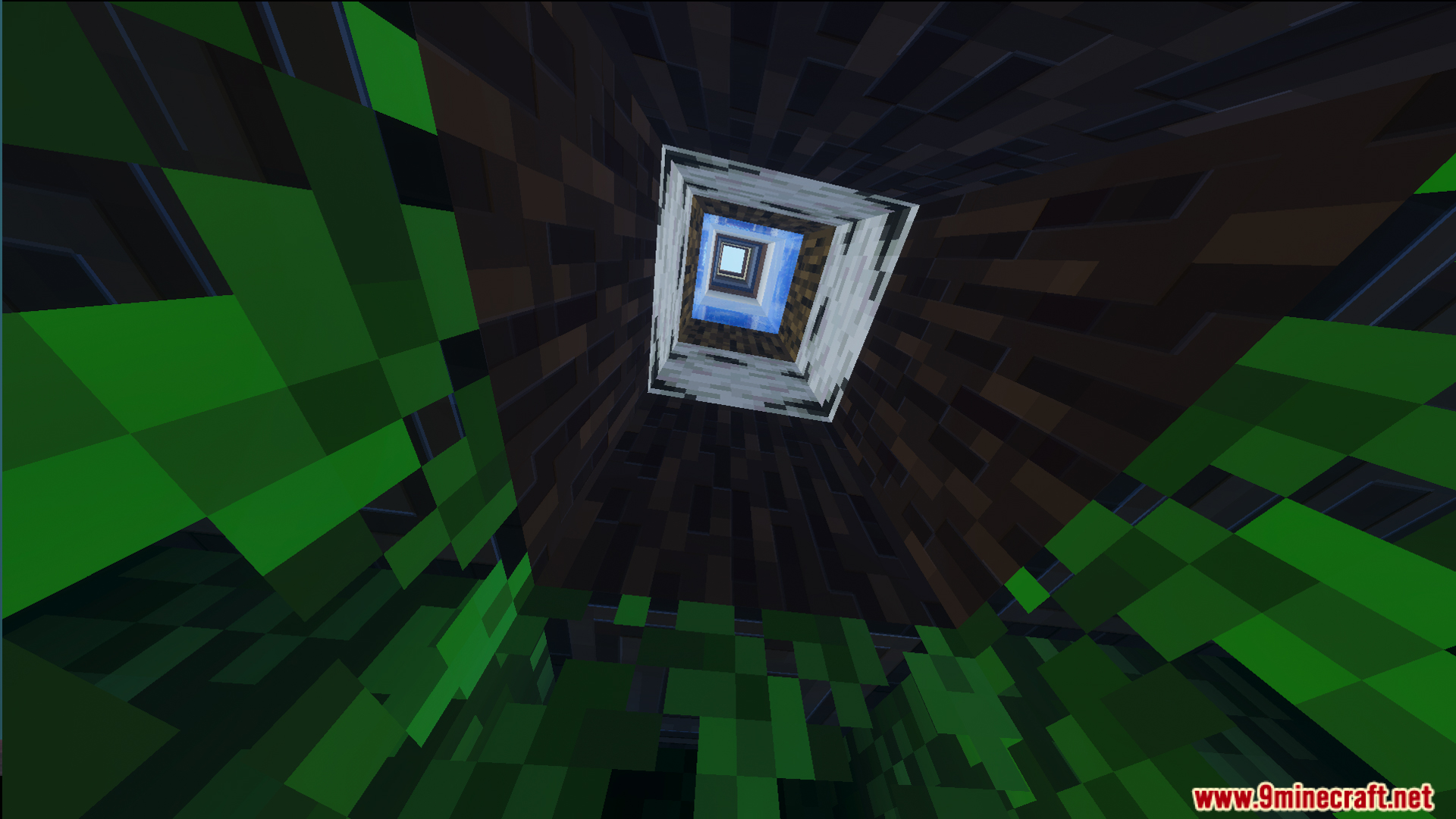 Looking up a narrow square shaft through layers of wood leaves and water