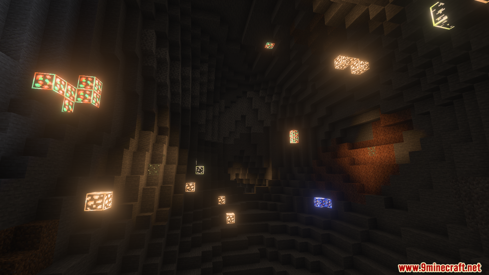 Better Glowing Ores Texture Pack Screenshot 5 glowing ore blocks scattered across a dark cave wall