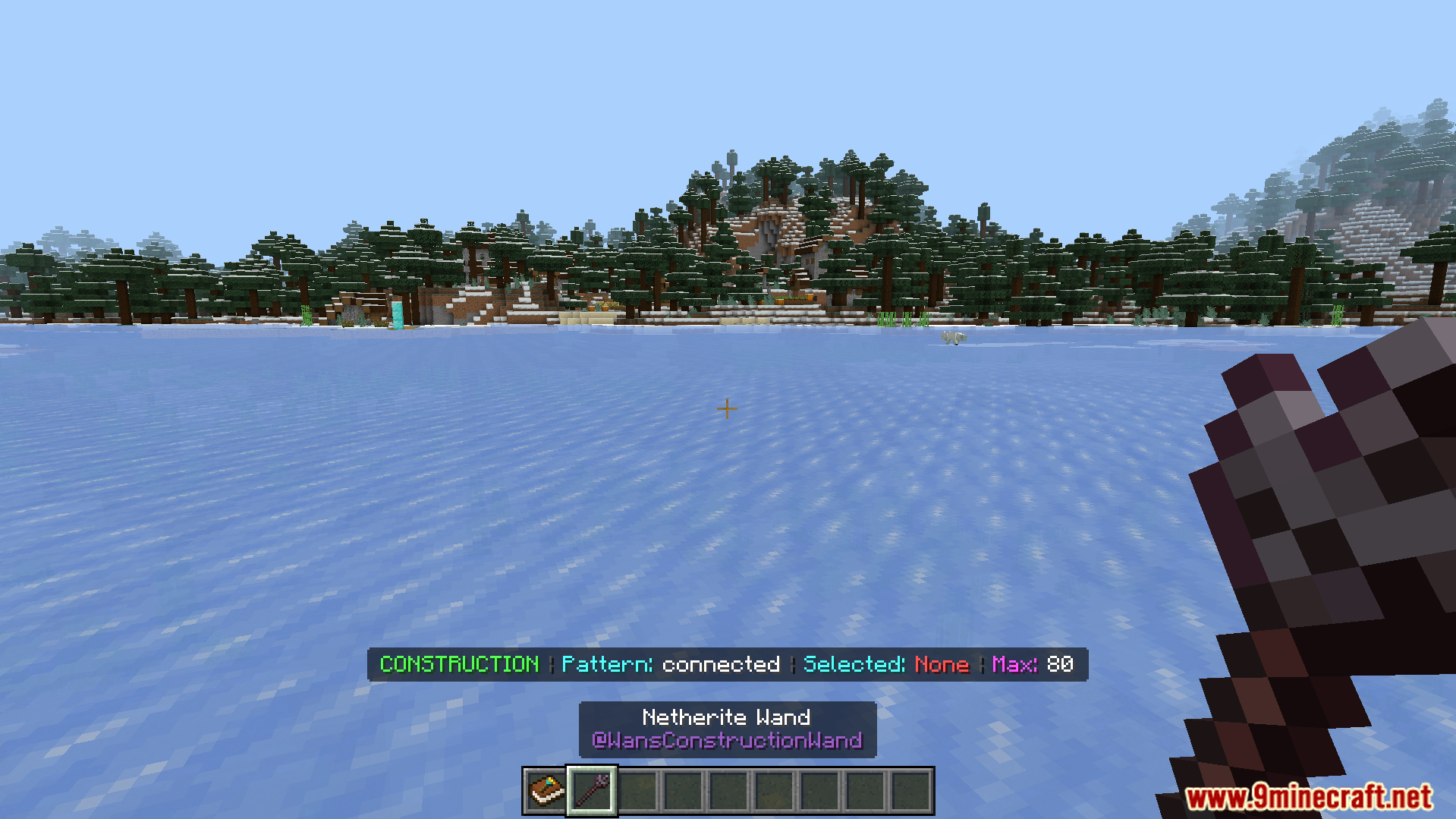 Construction Wands Addon Screenshot 5 Player holding a netherite wand with construction mode active on ice