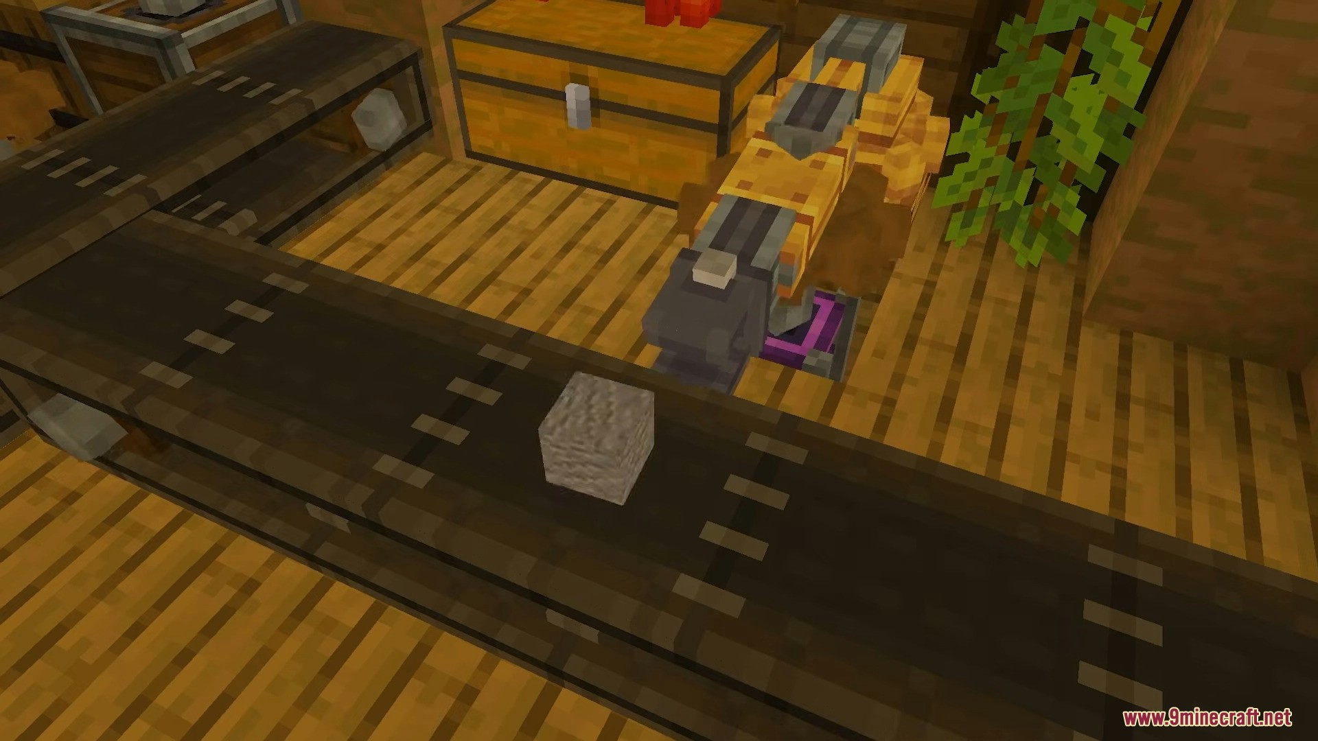 Create Bedrock Addon Screenshot 6 Mechanical arm interacting with a stone block on a conveyor belt near chests