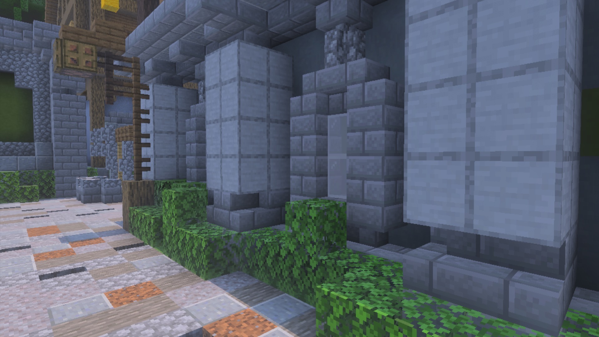 Close up of stone pillars and green leaves in a Minecraft town