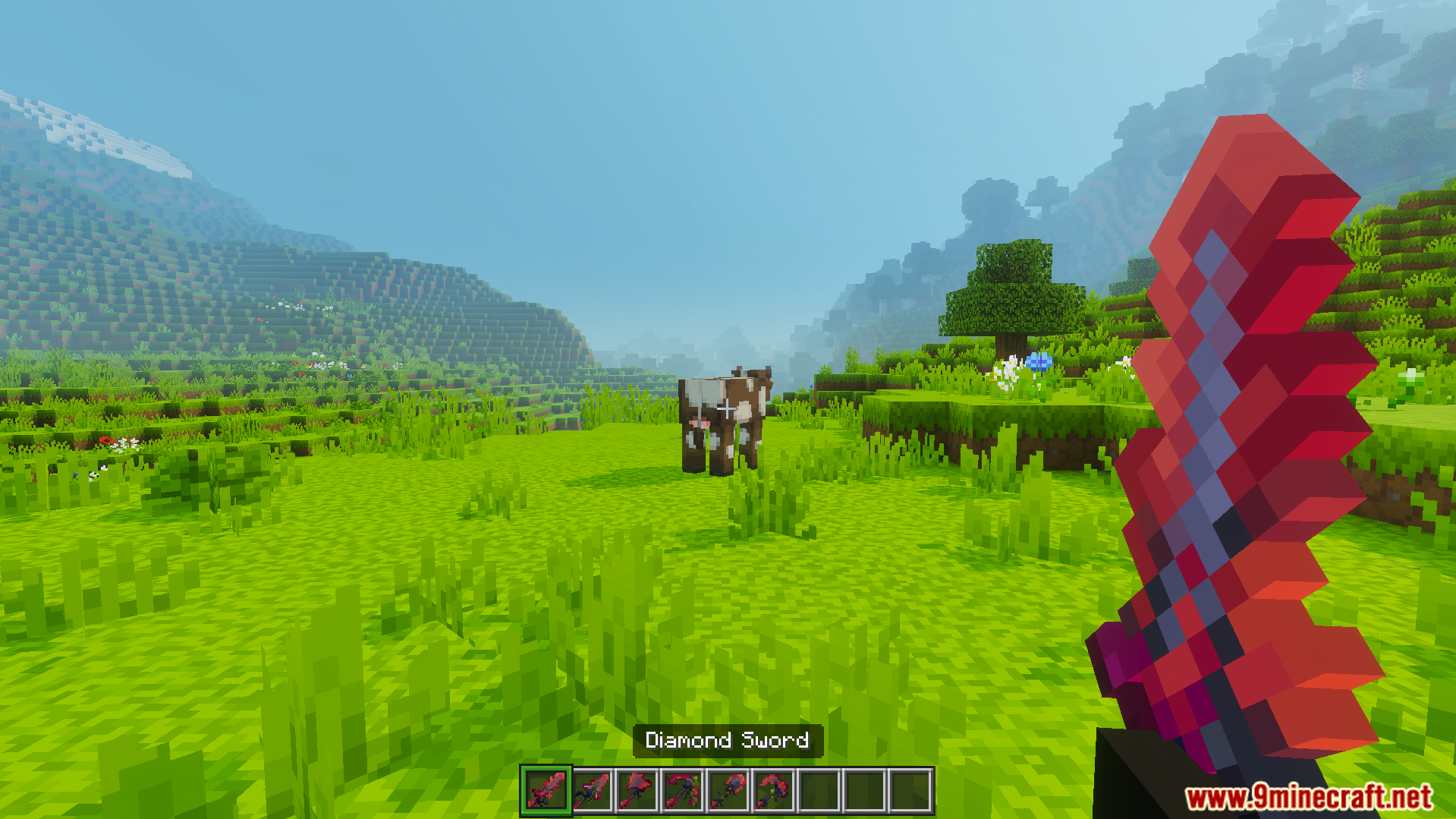 Cviko Fire Sea Tools Texture Pack Screenshot 8 A player holds a red diamond sword in a grassy field