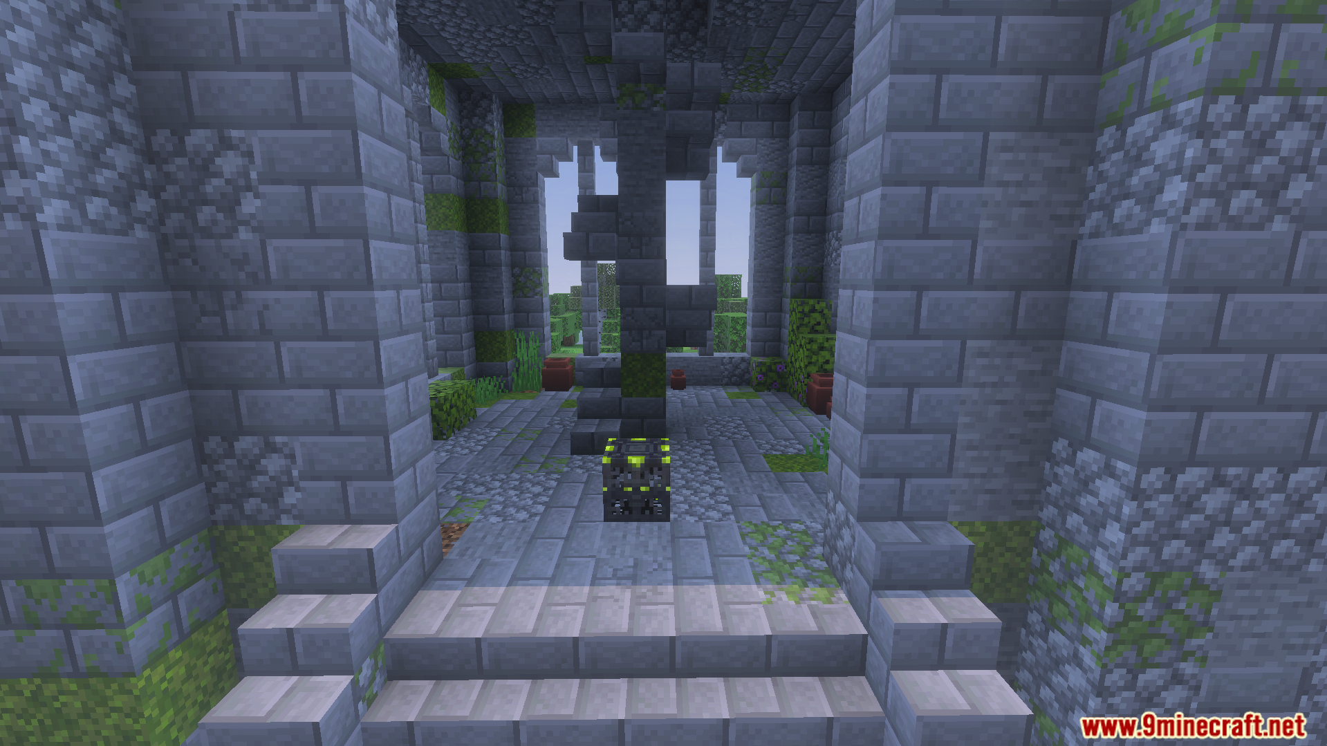 Inside a stone ruin featuring a monster spawner and a spiral staircase