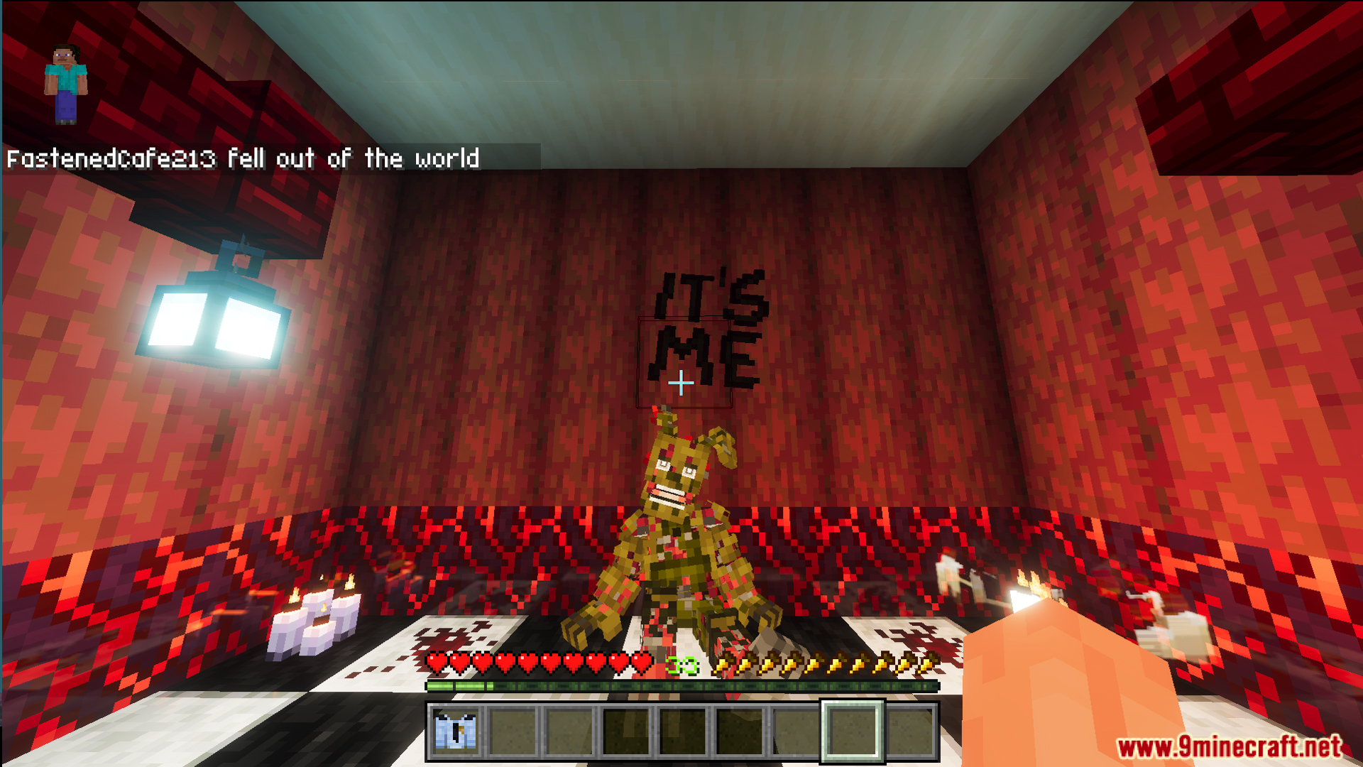 Player looking at a damaged animatronic in a room with red walls