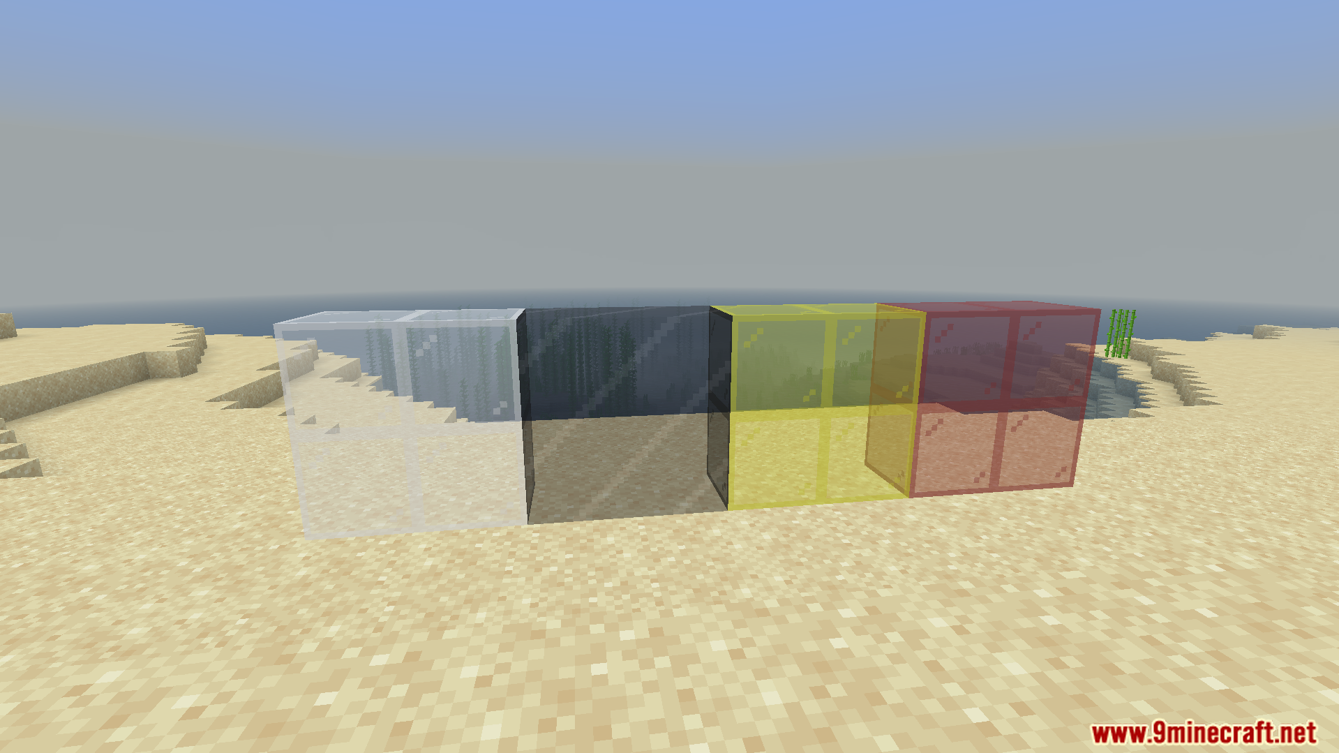 Colored glass blocks placed on sand in Minecraft Bedrock