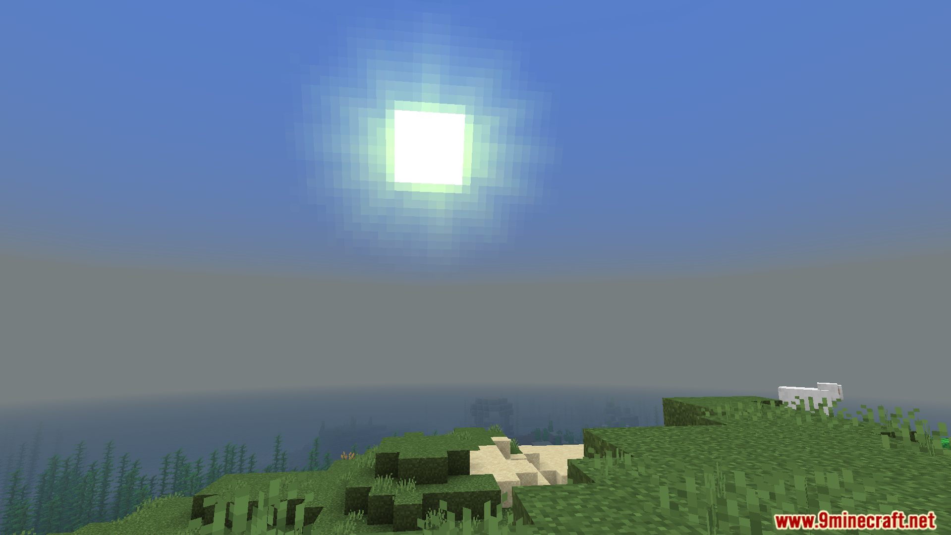 bright sun shining over a grassy hill and ocean in minecraft gameplay