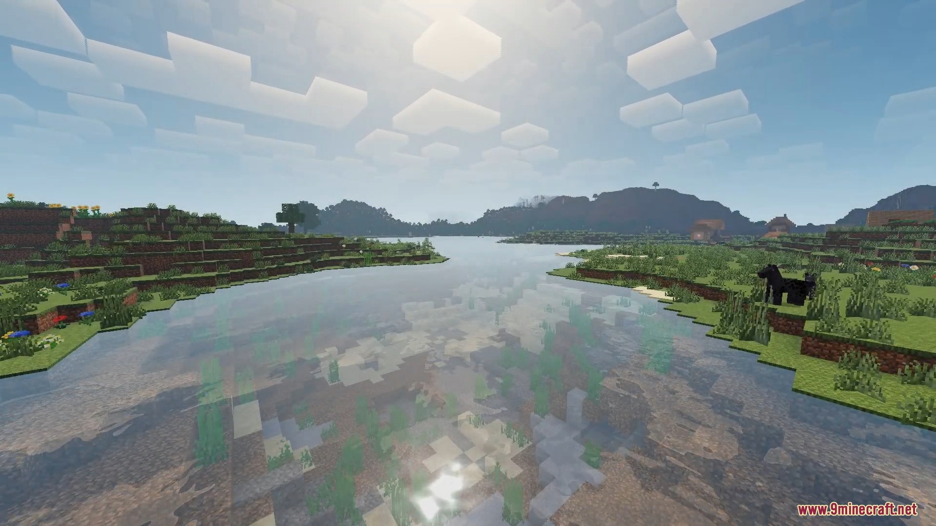 Scenic Minecraft landscape featuring a river with realistic water reflections and clouds