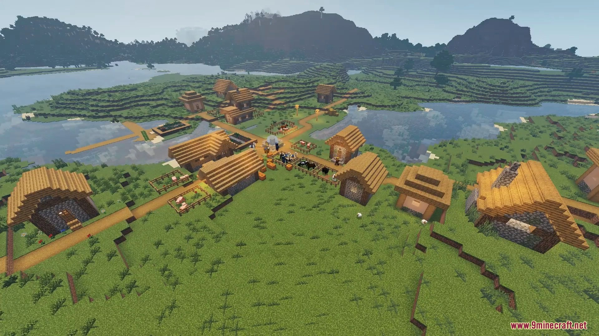 Aerial view of a Minecraft village located near a river with realistic lighting