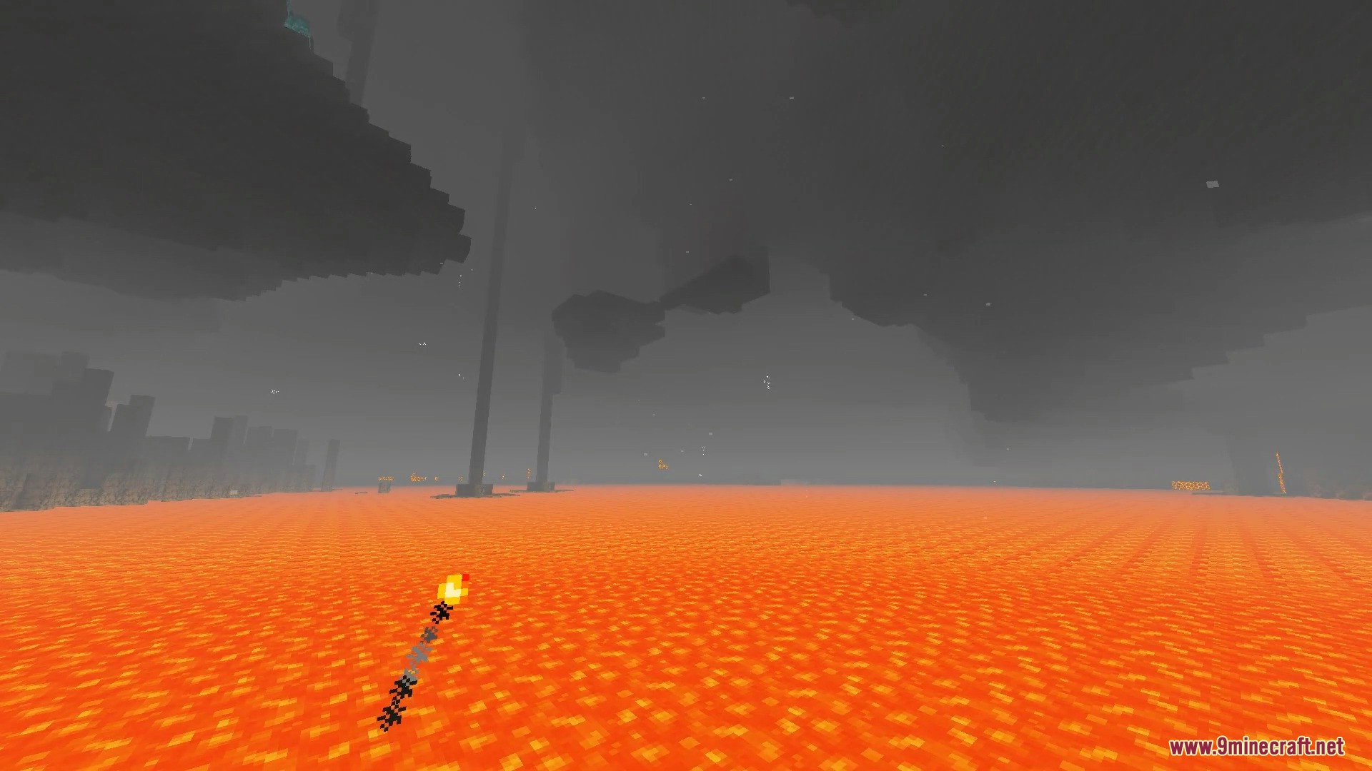 Vast lava lake in the Nether dimension with foggy atmosphere and a torch