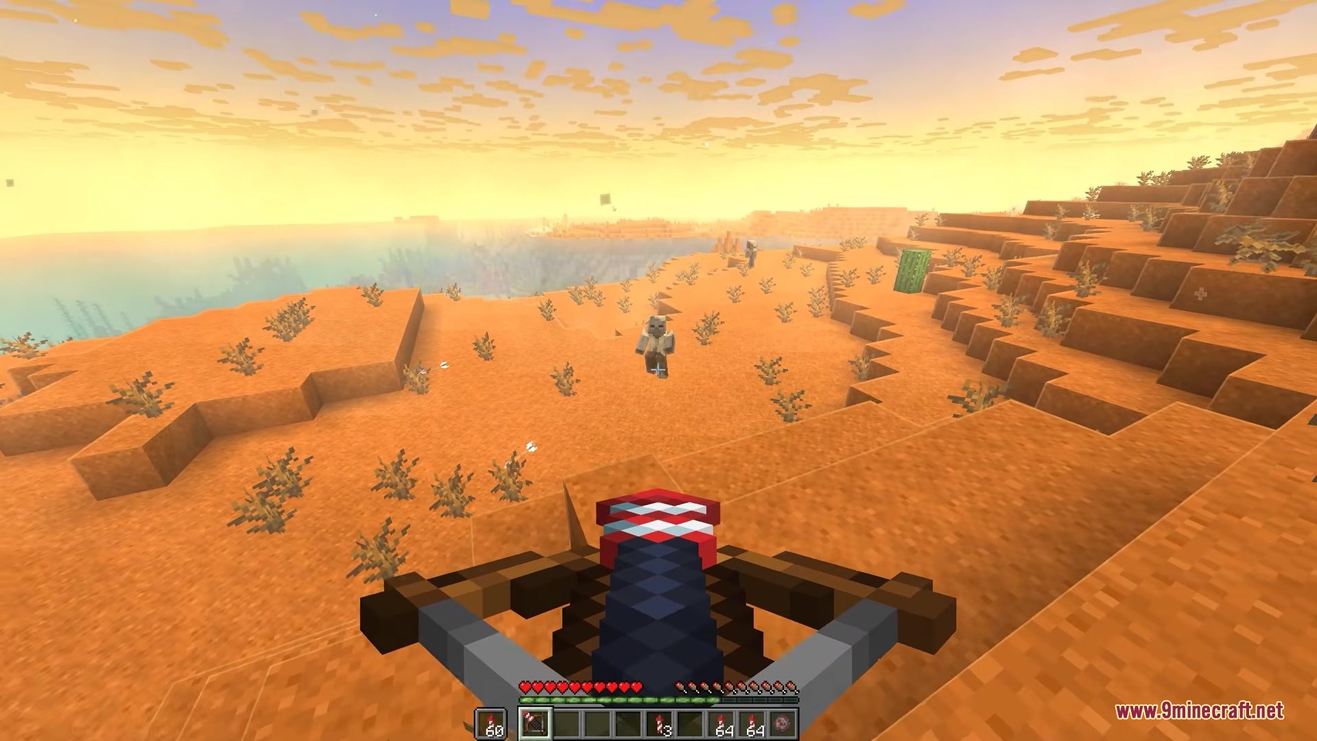 Player aiming a loaded crossbow at a Husk in the desert biome