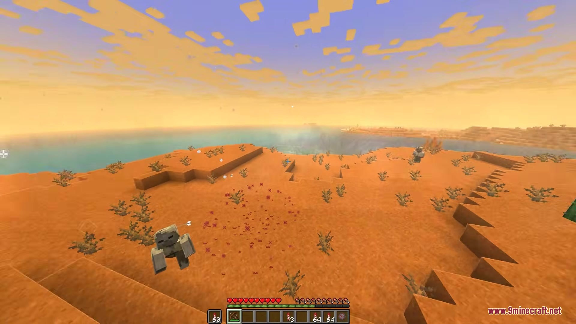 Red particles from a firework explosion appear near a desert Husk