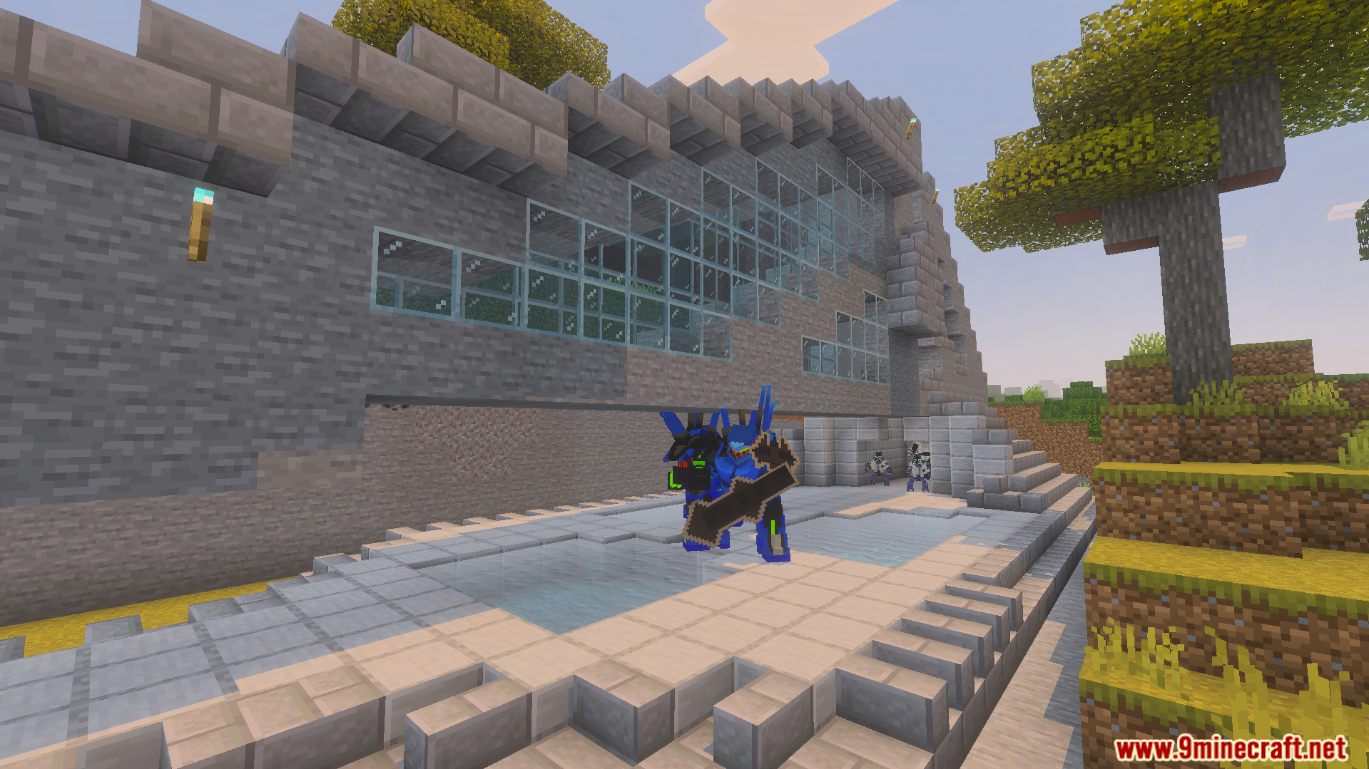 Blue armored Spartan holds a large weapon outside a stone base with glass