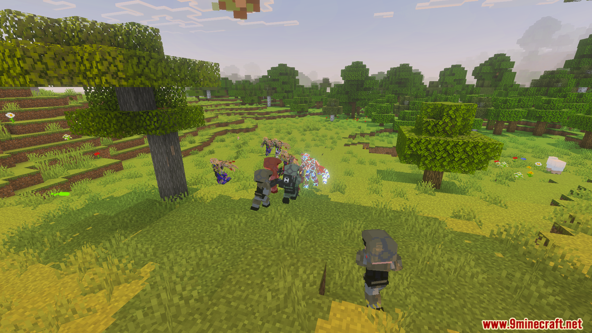 Spartan soldiers battle alien enemies in a grassy Minecraft field