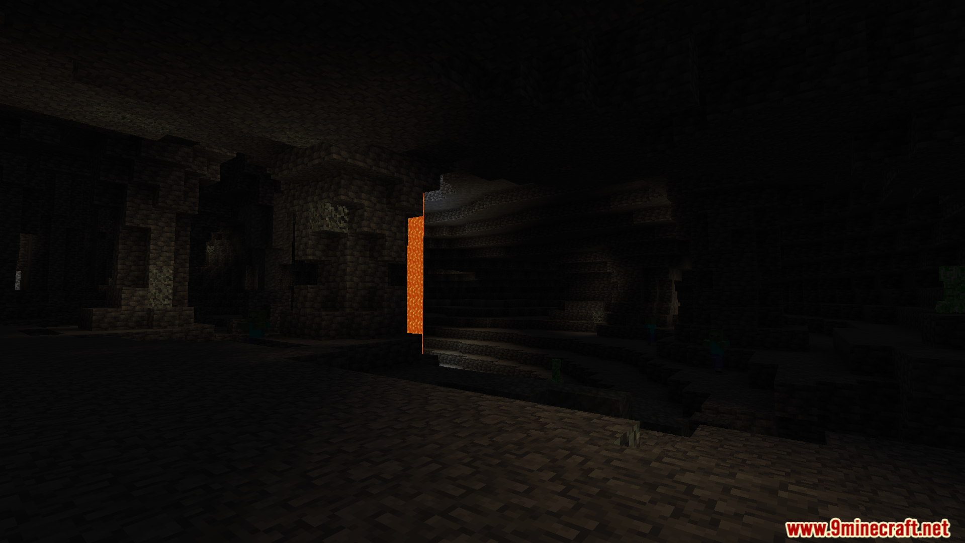 A dark underground cave with lava before the night vision is active