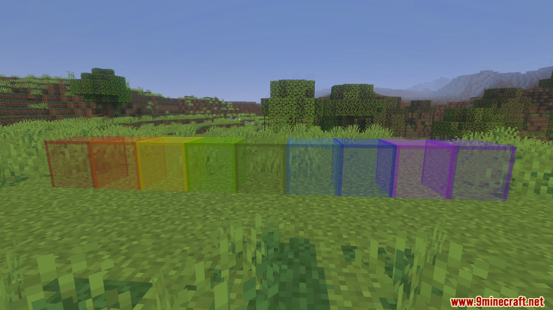 KwZs Connected Glass Addon Screenshot 4 Various colored glass blocks connected together without lines in a grassy field